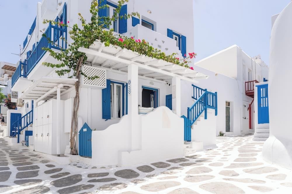 Eleanna's Mykonos - In the vibrant heart of Mykonos Town just behind the main street, Eleanna's offers seamless access to the island's electric party scene. The modern-traditional vibe and helpful staff sharing local nightlife tips make it perfect for social travelers.